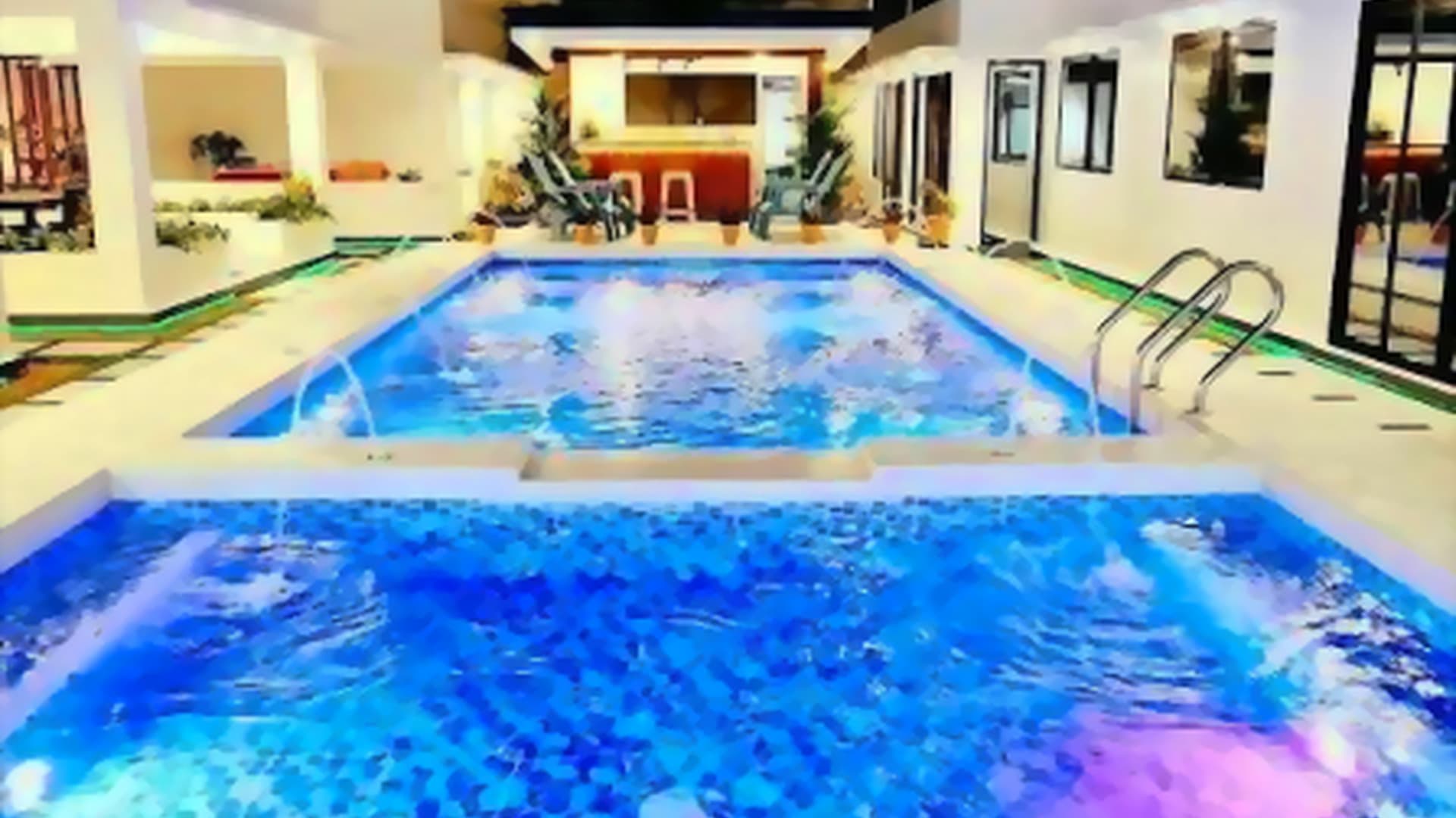 Villa Masculino pool lit up at night